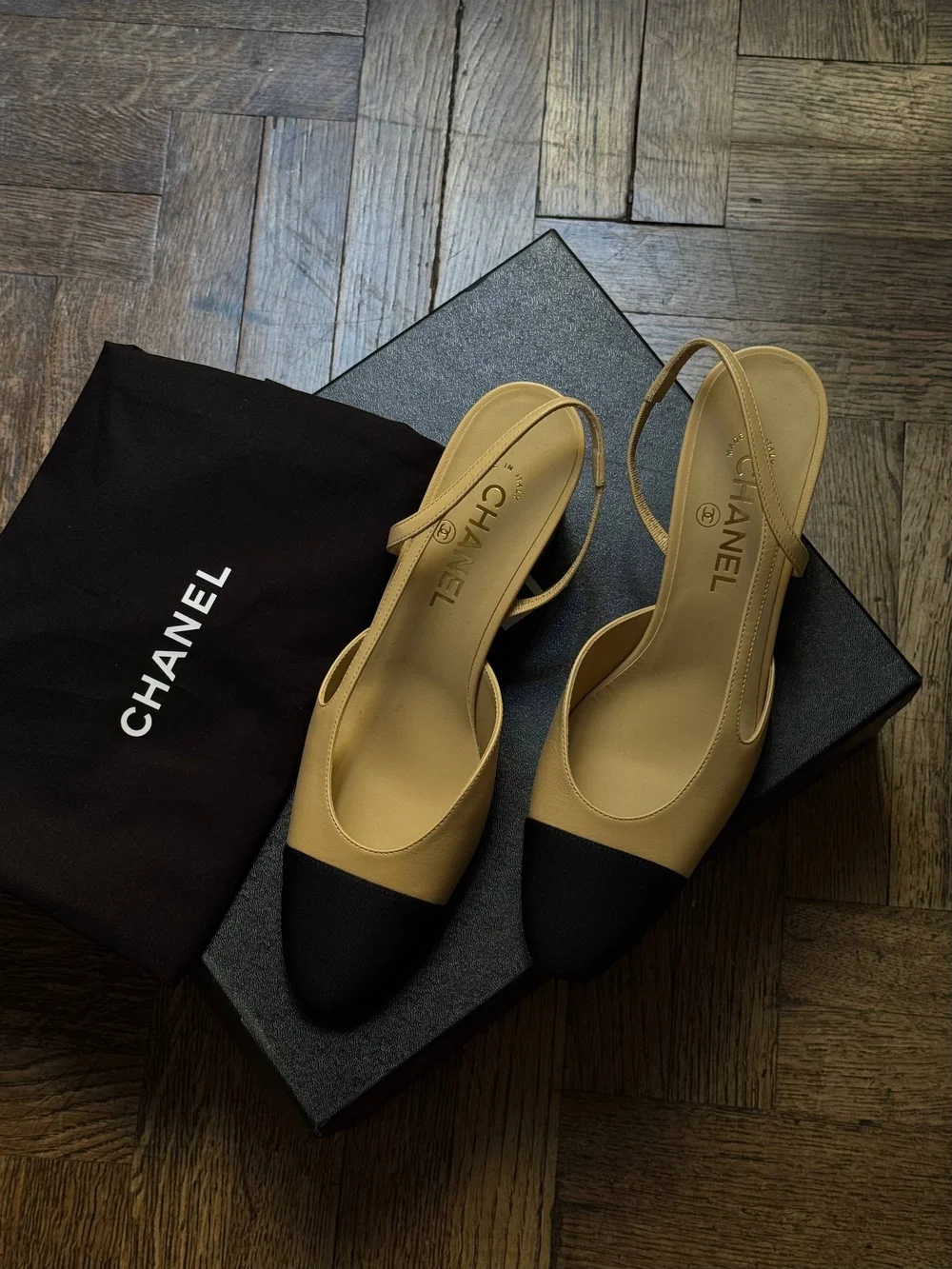 CHANEL Beige Slingback Pumps with Black Cap Toe